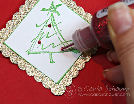 Adding glitter accents to Christmas gift tags by Carla Schauer Designs