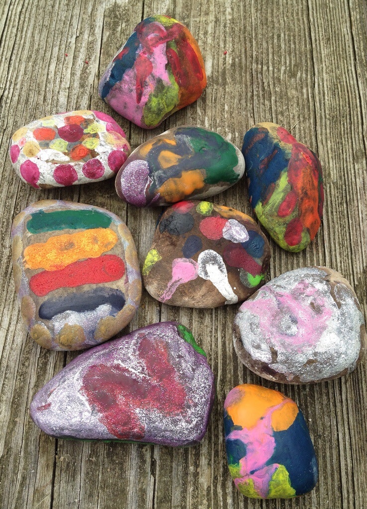 Campfire Wishing Stones Melted Crayon Rock Craft on picnic table.