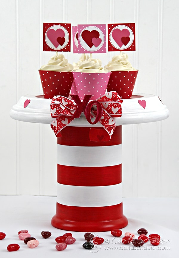Make a love-themed cake stand for Valentine's Day or anniversaries using acrylic paint and terra cotta flower pots. Tutorial from Carla Schauer Designs at carlaschauer.com.