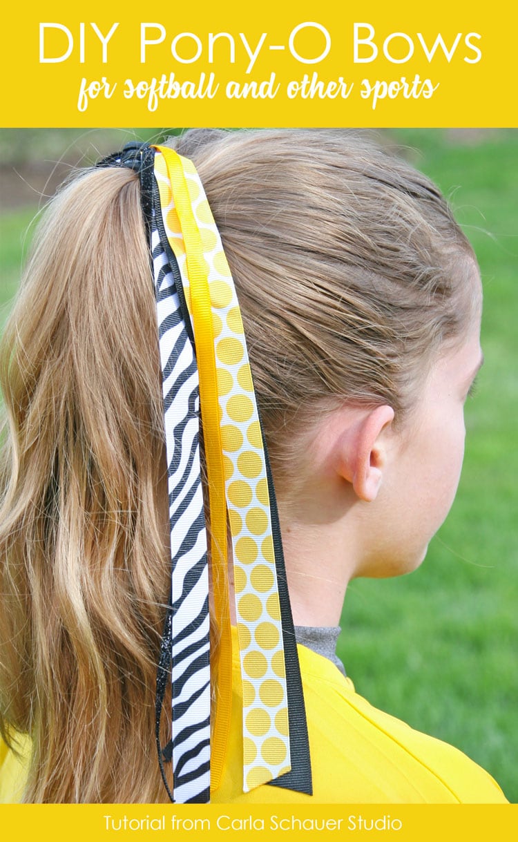 Girl wearing yellow, black and white streamer hair bow, with text for pinning.