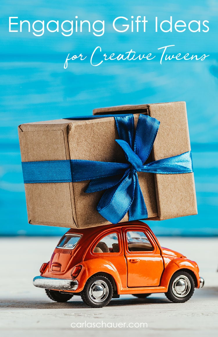 Orange toy car carrying gift with text overlay for pinterest.