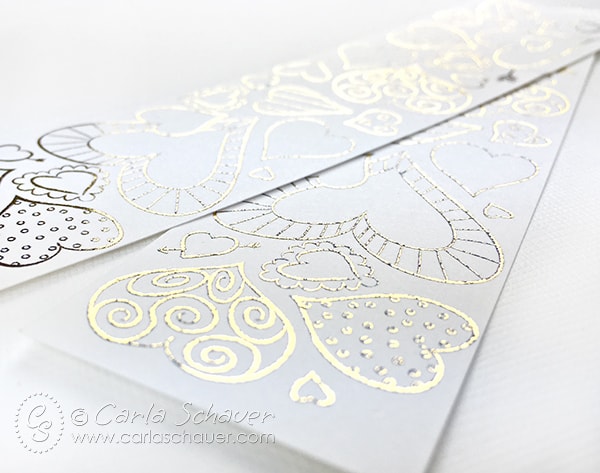 white bookmarks with gold foil hearts.