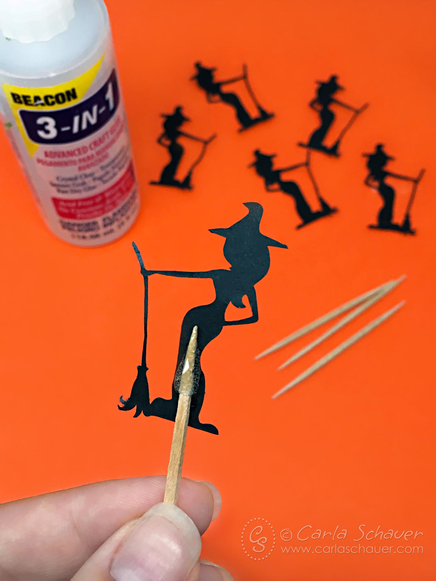 Make Halloween cupcake toppers with a cute witch svg cutting file from Carla Schauer Designs. 