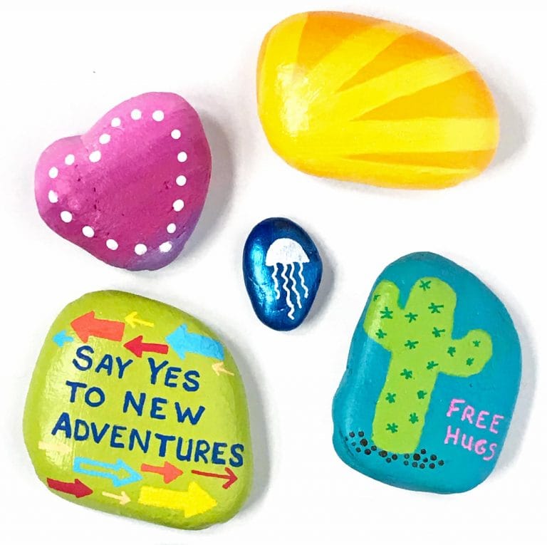 painted rocks on white background
