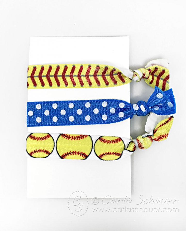 3 Softball themed elastic Hair Ties wrapped around white Cardstock