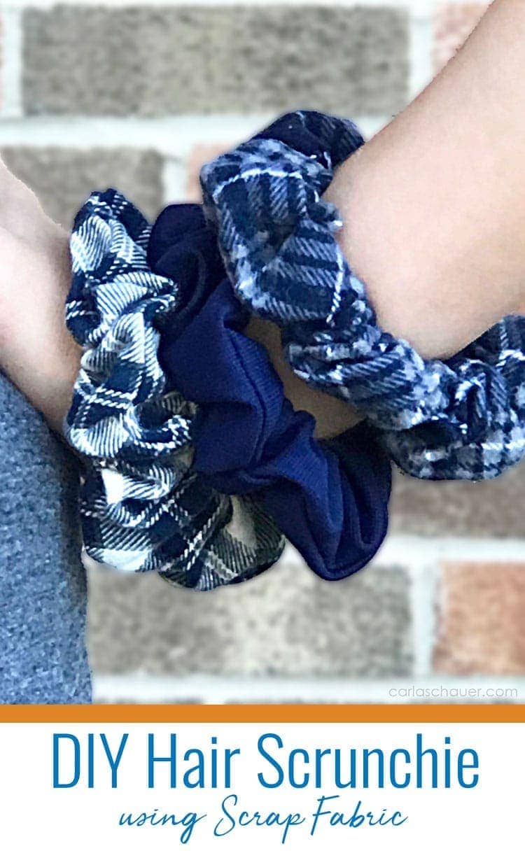3 blue flannel scrunchies on girl's wrist.