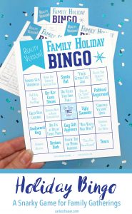 Funny Reality Holiday Bingo card held over blue background, including text for pinterest.