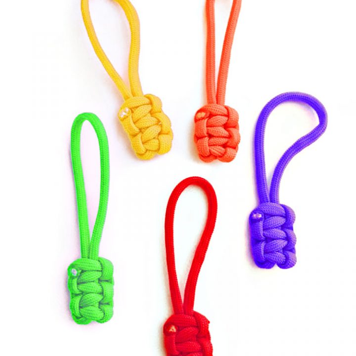 Paracord zipper pulls in multiple colors on white background