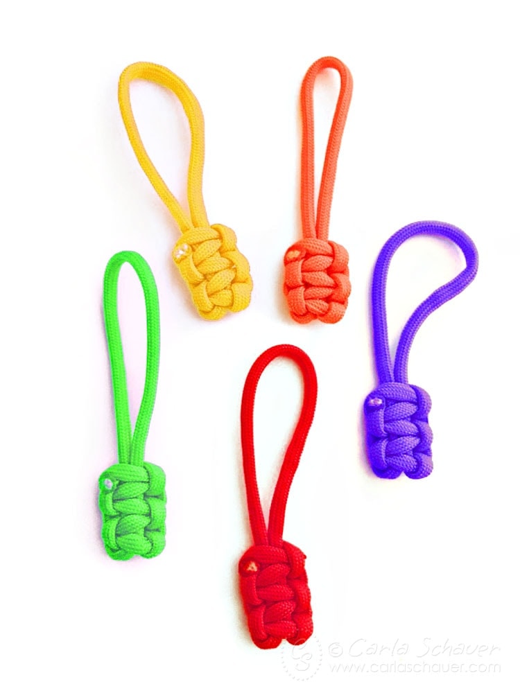 Paracord zipper pulls in multiple colors on white background