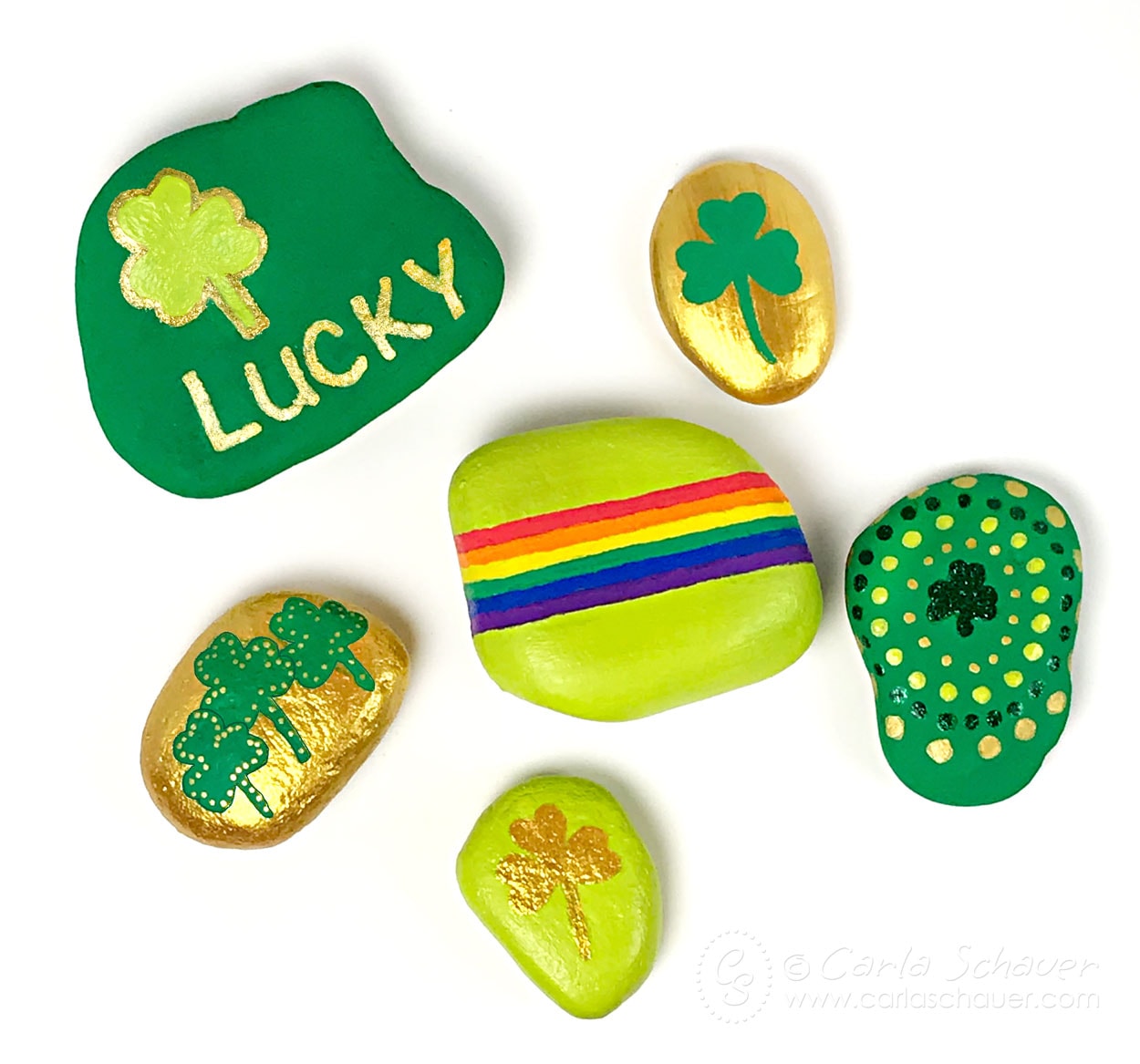 Shamrock Painted Rocks on white background.