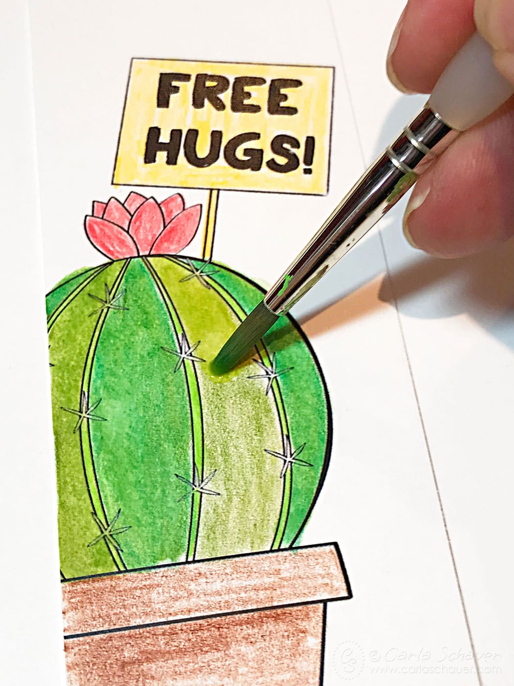 Water blending colored pencils on printable cactus bookmark.