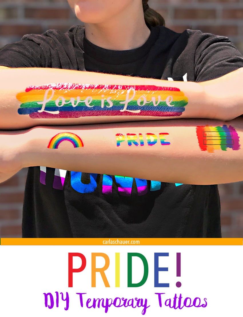 Rainbow DIY Pride temporary tattoos on crossed arms.