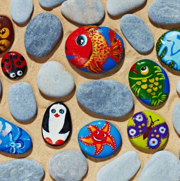 A mix of animal painted and unpainted flat stones.