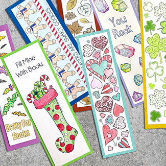 Colored printable bookmarks laying on cement background with descriptive text.