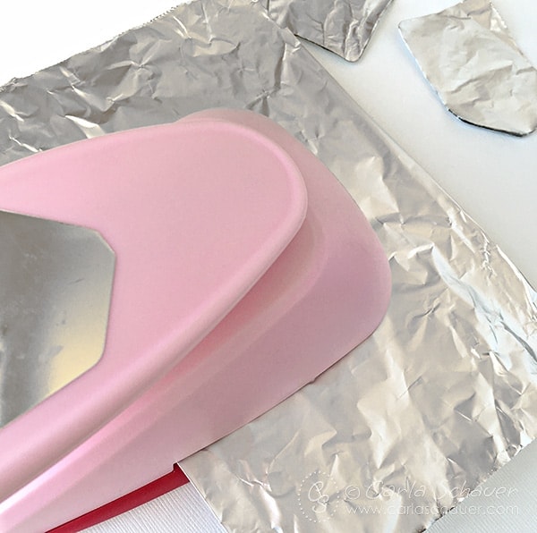 pink tag punch, punching through silver aluminum foil to sharpen