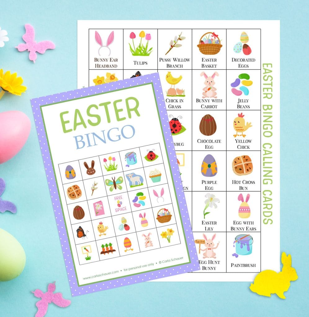 Easter bingo card with purple border and calling card sheet, both with colorful spring icons. Pages are lying on blue background with pink and yellow felt animal cutouts and eggs.